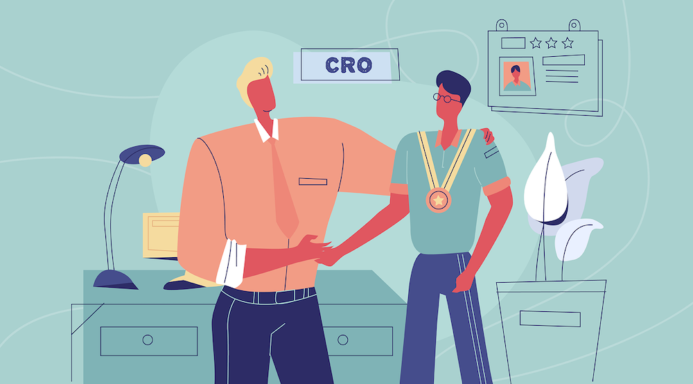 A CRO shakes hands with another risk assurance professional. 