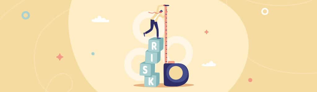 A man balances on blocks that spells risk while measuring them symbolically.