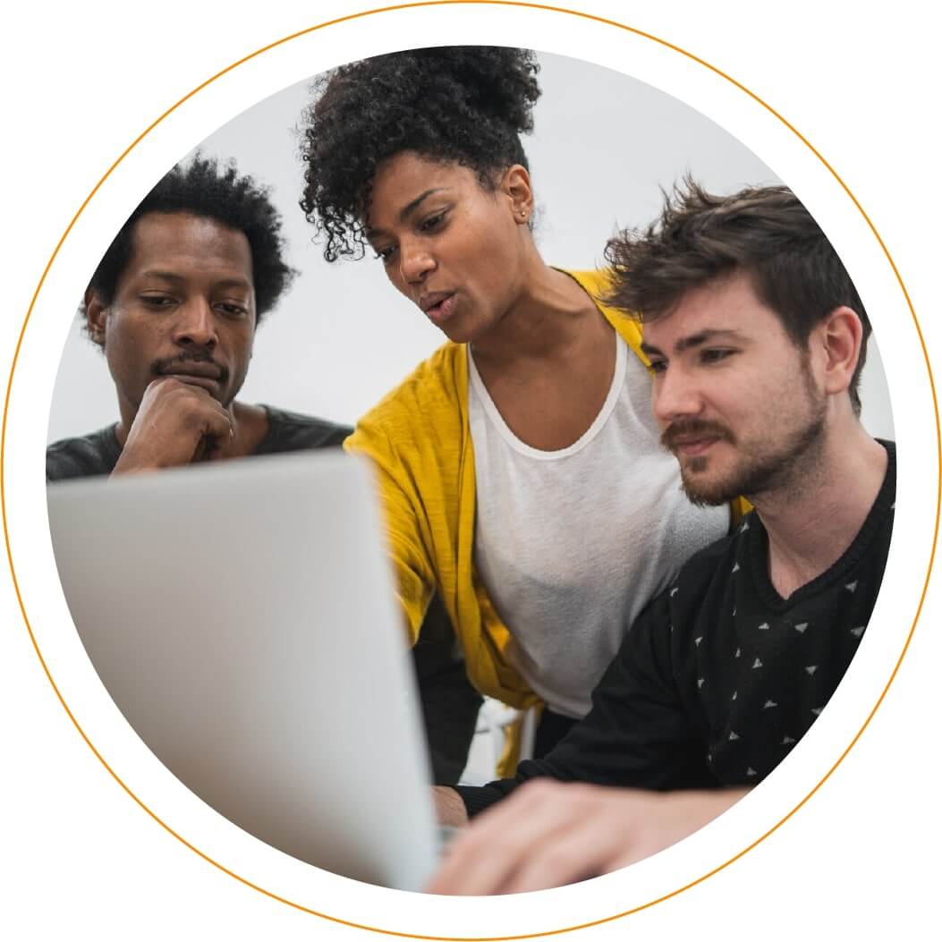 Decorative - group of colleagues working on laptop